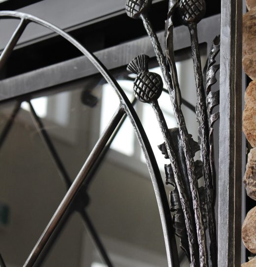 Thistle in Fireplace Screen at Manor House (Crossmount Centre for Healthy Aging)